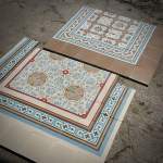 historic tile reproductions spread out on the warehouse floor