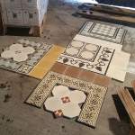 historic tile reproductions spread out on the warehouse floor